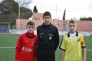 El Colegiado con los capitanes del partido